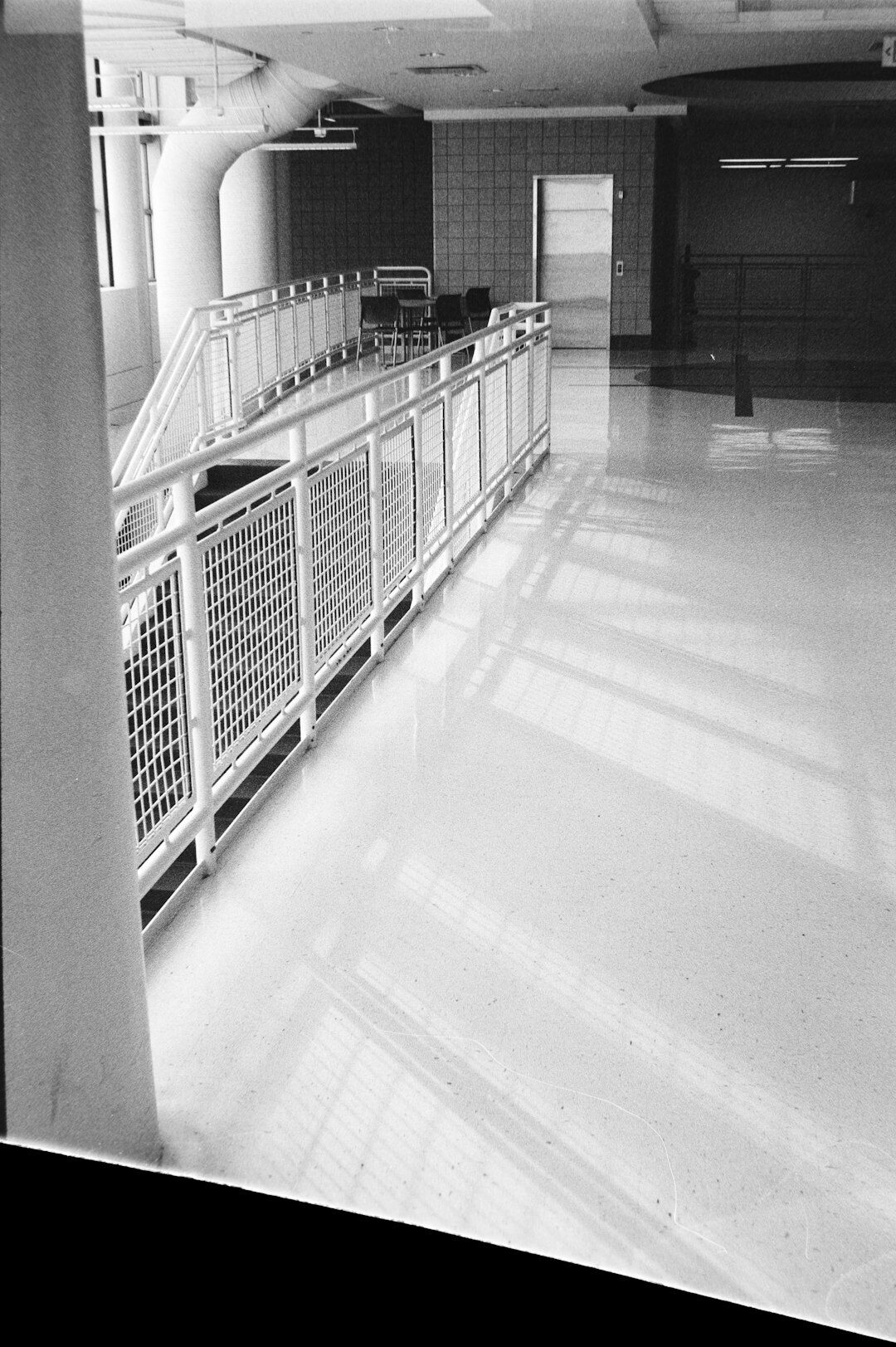 Wide accessible hallway with handrails inside a community center