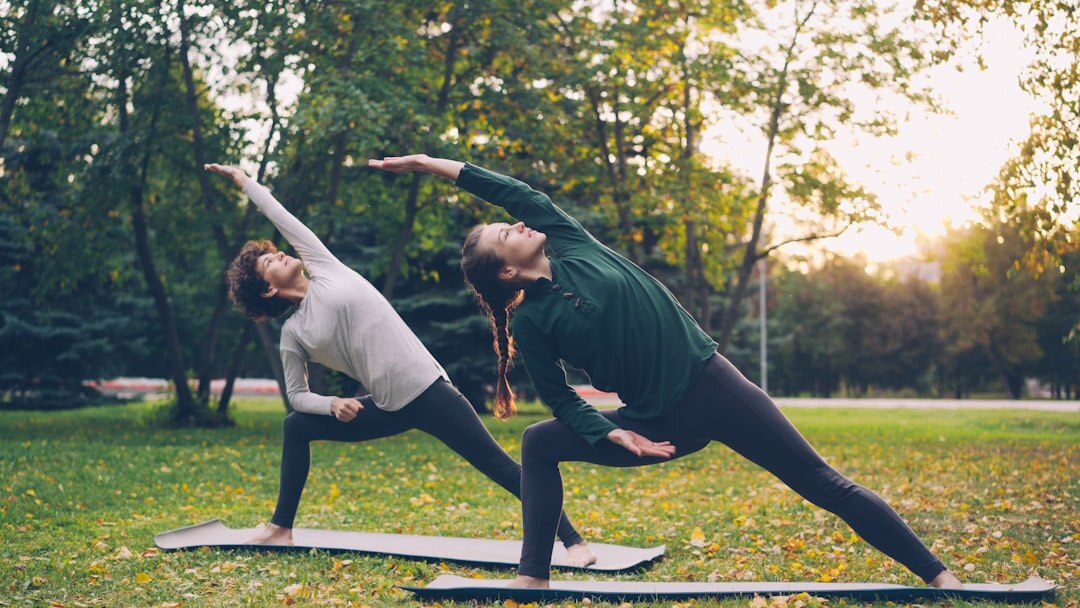 seniors doing yoga outdoors