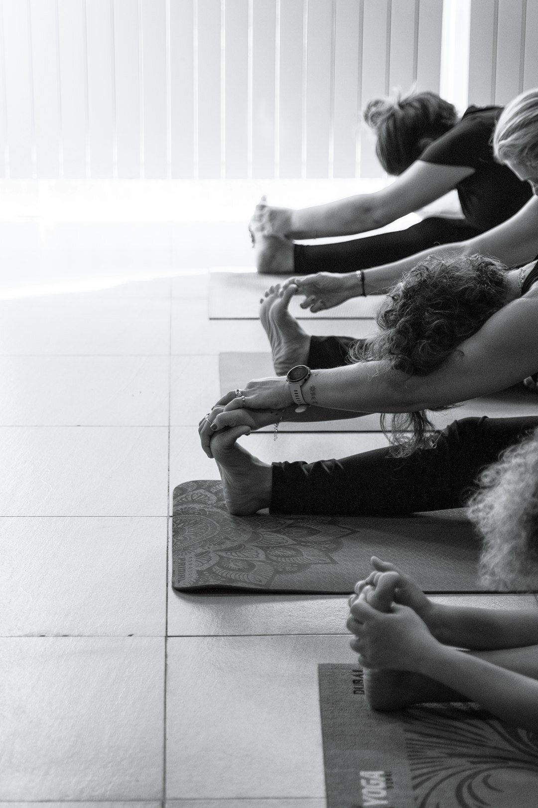 seniors doing yoga in studio